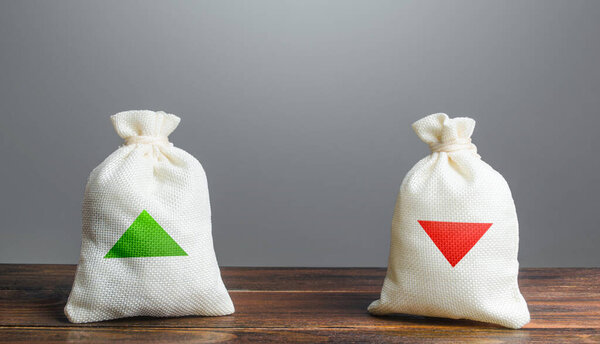 Two bags with green and red arrows up and down. Risk planning. Advantages and disadvantages. Useful and harmful. Decision making, evaluating profit consequences. Choice between positive and negative.