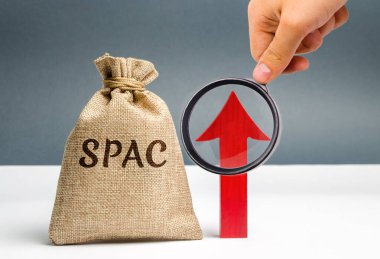 Money bag with the word SPAC and an up arrow. Special purpose acquisition company. Simplified listing of company, merger bypassing stock exchange IPO. Growth, increase. Assessment of benefits clipart