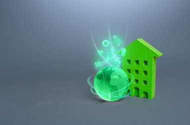 Çevresel sembolleri olan yeşil çok katlı bir bina ve küre. Yüksek talepler, barınma standartları. Çevre dostu, enerji verimliliği, sıfır karbon emisyonu. Karbon tarafsızlığı.
