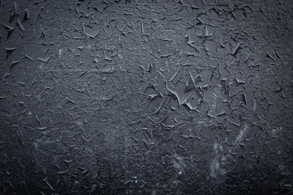 The old grunge texture of black paint-painted metal. Blackout to the corners of the background — Stock Photo, Image