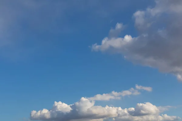 Blue skies with low clouds. Light clouds in summer weather