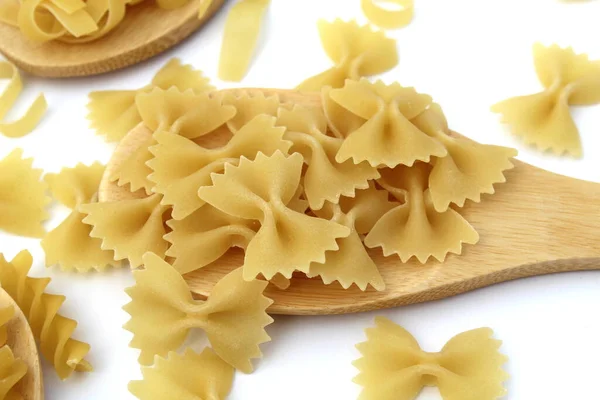 Pasta Form Bows Lie Wooden Spoon White Background — Stock Photo, Image