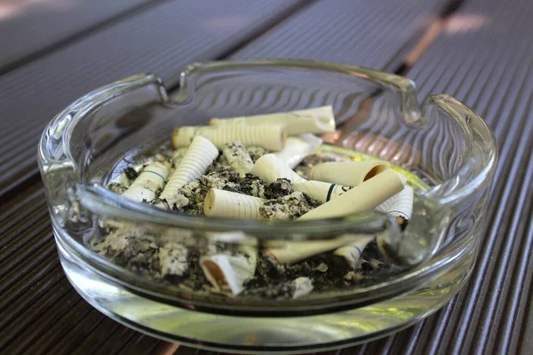 Glass Ashtray Remains Cigarette Filters Table Stock Picture
