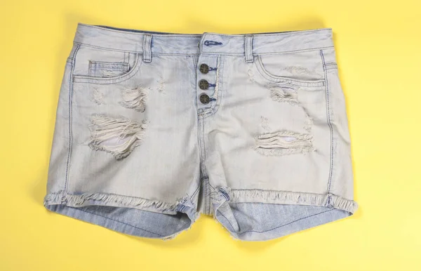 Women Denim Shorts Fading Yellow Background Close — 图库照片