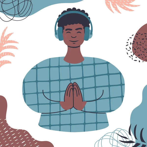 Ses güdümlü meditasyon. Kulaklıkla rahatlayan Afrikalı genç bir adam..