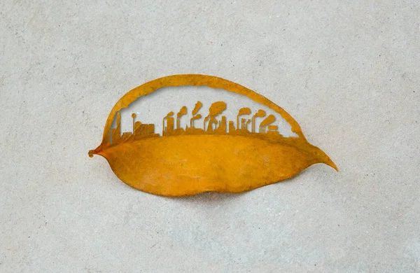 Şehir binası kuru yaprak kesiyor. Şehir ve sanayi fabrikaları dünya üzerinde büyüyor. Endüstriyel zehirli duman çevreyi yok eder. Dünyayı yeşil doğal ekolojiden kurtar..