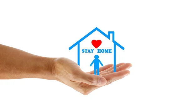 Evde kal. El ele tutuşmak, kırmızı kalple evde kalmak. Salgının Covid-19 virüsünden sosyal uzaklığı.