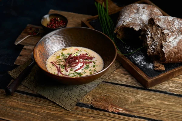 Traditional Italian soup with barley and bresaola on old wooden background. Selective focus. Dark tone. — Stock Image Traditional Italian soup with barley and bresaola on old wooden background. Selective focus. Dark tone. Stock Picture