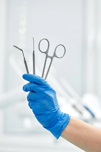 Close-up of dentists hands and dental equipment