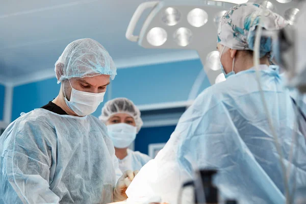 Team surgeon at work in operating room. — Stock Photo, Image