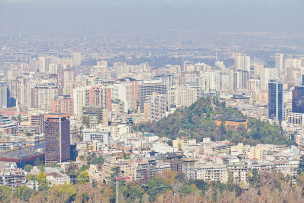 Santiago cityview from Cerro San Cristobal. Buldings and cerro Santa Lucia can be seen. Pollution is present too.