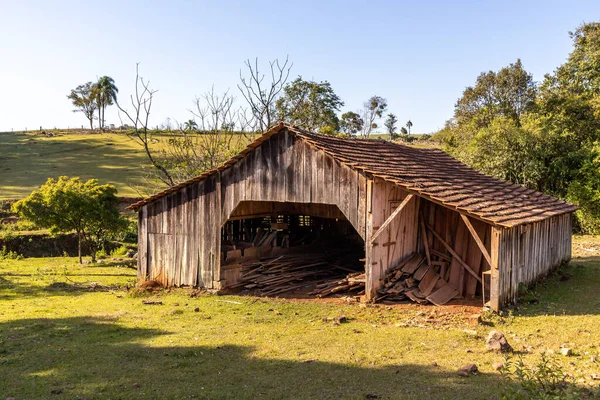 Wood barn in a farm field, Santa Cruz do Sul, Rio Grande do Sul, Brazil