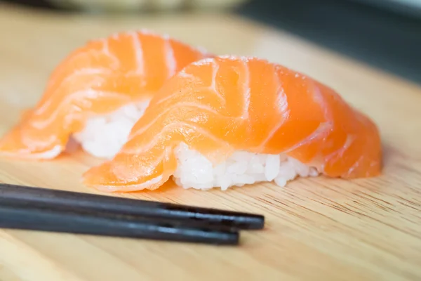 Sushi salmon on wood background — Stock Photo, Image