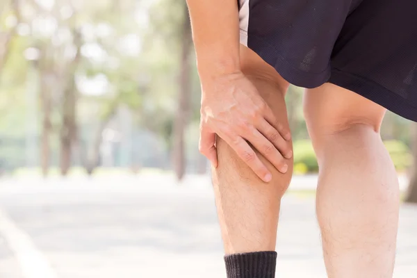 Cramp in leg while exercising. Sports injury concept — Stock Image Cramp in leg while exercising. Sports injury concept Stock Image
