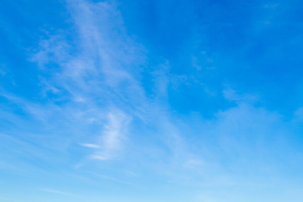 Blue sky with tiny clouds