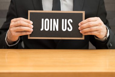 Bize katılın. Word'ün siyah afiş yazma ve işadamı tarafından holding