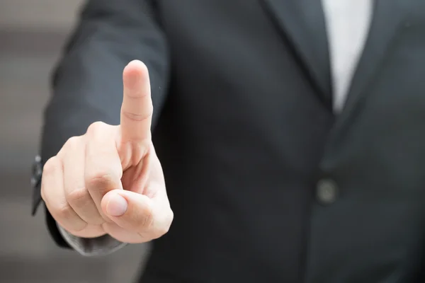 Businessman pushing on a touch screen — Stock Photo, Image