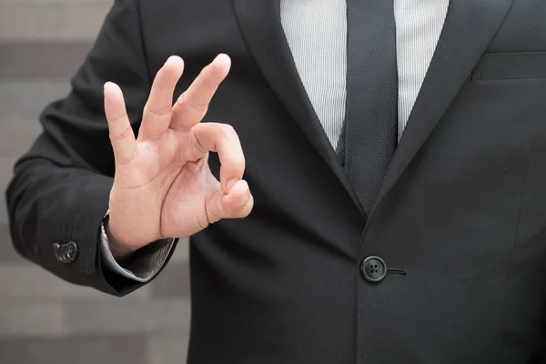 Businessman in suit and doing ok sign — Stock Photo, Image