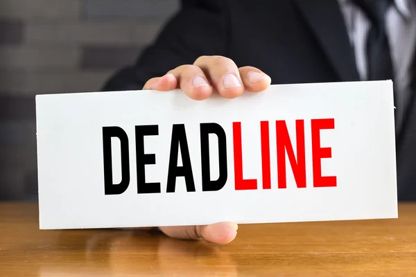 Deadline, message on white card and hold by businessman — Stock Photo, Image