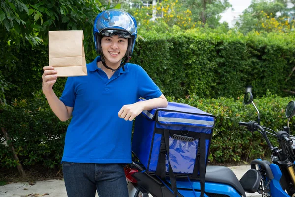 Young Asian man with delivery box, Motorcycle delivering food express service concep