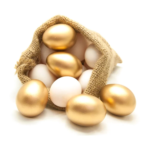 Golden egg in canvas sack — Stock Photo, Image