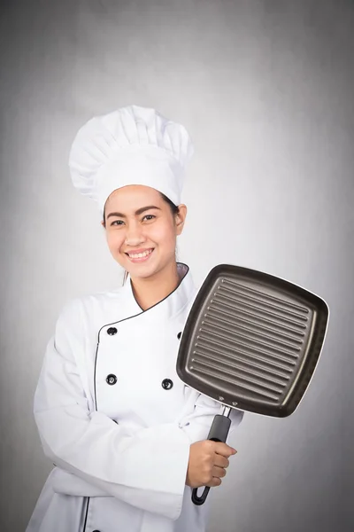 Mujer chef sosteniendo pan — Foto de Stock