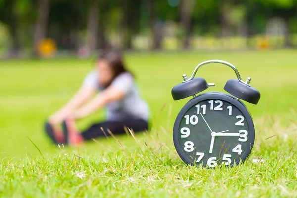 Exercise in the morning and black clock — Stock Photo, Image