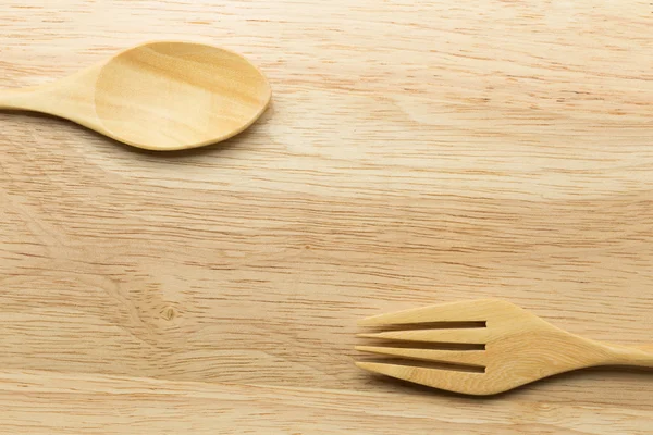 Tahta kaşık ve çatal ahşap arka plan üzerinde