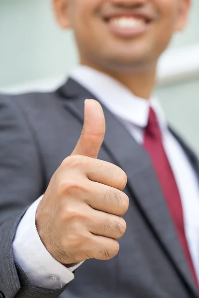 Asian businessman showing thumb up — Stok fotoğraf