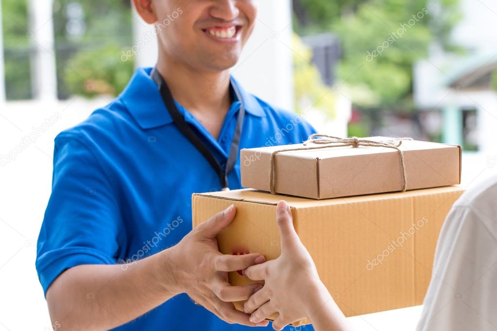 Woman hand accepting a delivery of boxes from deliveryman