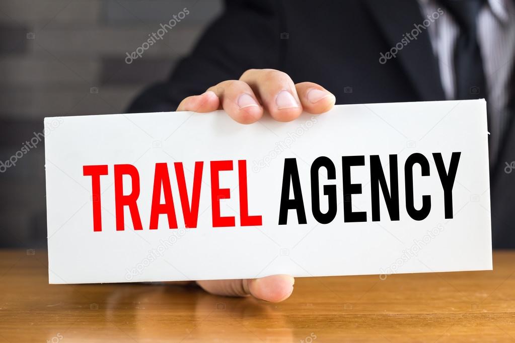 Travel agency, message on white card and hold by  businessman