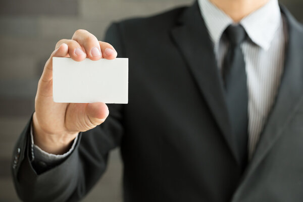 Businessman showing blank business card