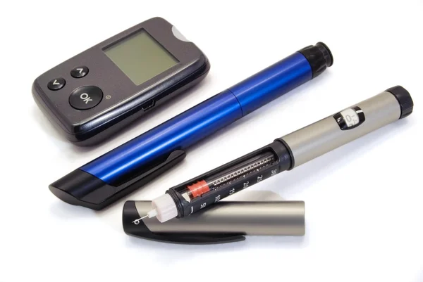 Insulin pen and glucometer — Stock Photo, Image