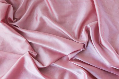 Pembe kumaş, kıvrımlı doğal ipek, üst görünüm, romantik tebrikler için arka plan