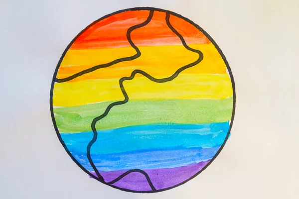 Drawn Earth on paper is painted with watercolors in all colors of rainbow