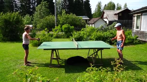 Older Man Woman Playing Table Tennis Garden Courtyard Slow Motion — Stock Video