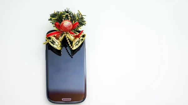 Smartphone ve Noel çanları — Stok fotoğraf