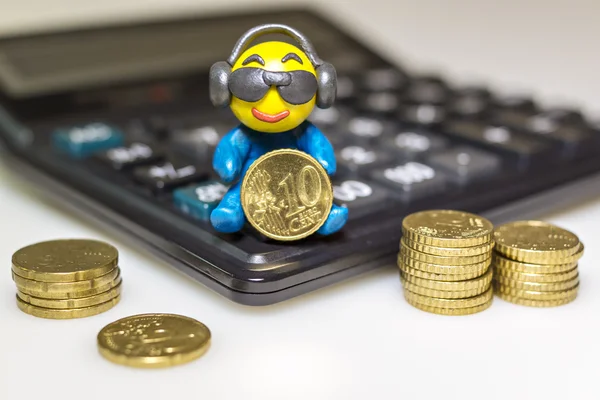 Funny plasticine man with euro coins — Stock Photo, Image