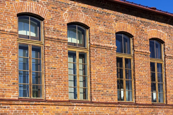 Red brick retro house with windows — Stock Photo, Image