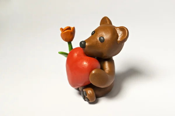 Plasticine bear with flower and eight — Stock Photo, Image