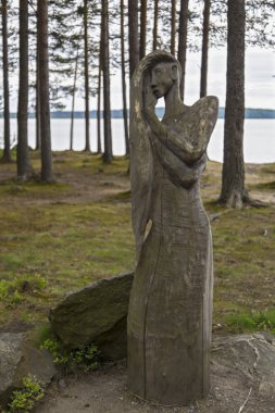 Idol of woman in forest