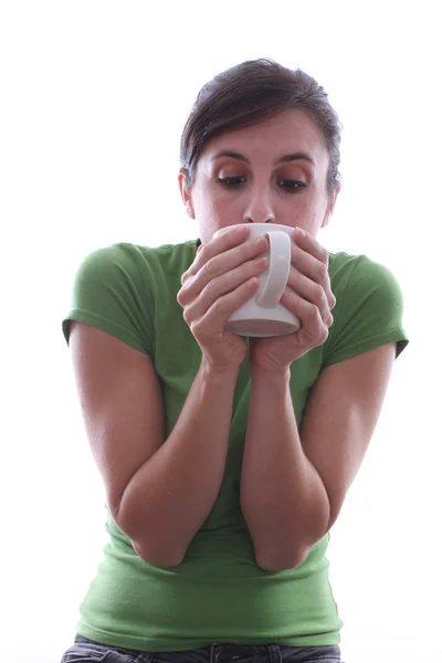 Female looking into a mug — Stock Photo, Image