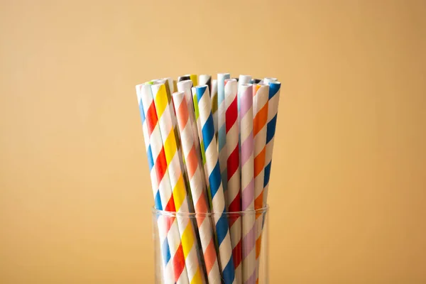 Colorful paper straws. Event and party supplies. Biodegradable straws, pollution concept. Zero waste. Copy space