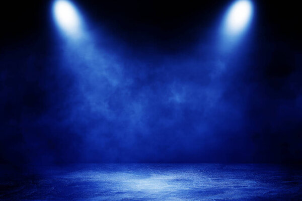 Empty space of Studio dark room concrete floor grunge texture background with blue lighting effect and smoke in background.