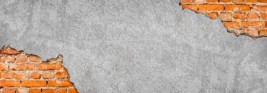 Tuğla duvar grunge doku arkaplanlı boş alan alçısının soyut resmi.