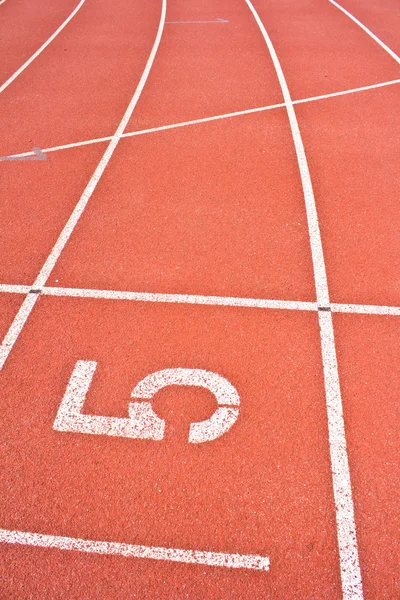 Number five on running track rubber — Stock Photo, Image
