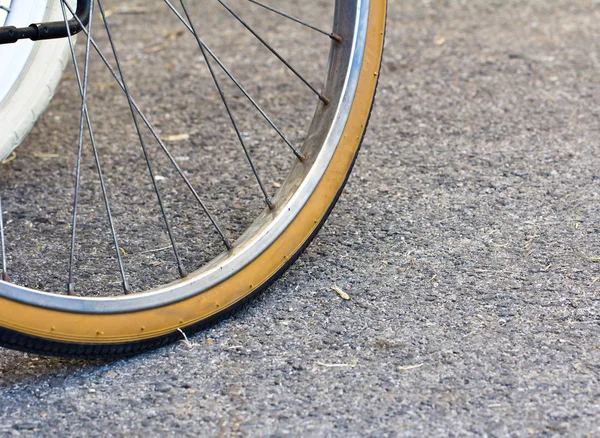 Bicycle wheel on the road — Stock Photo, Image