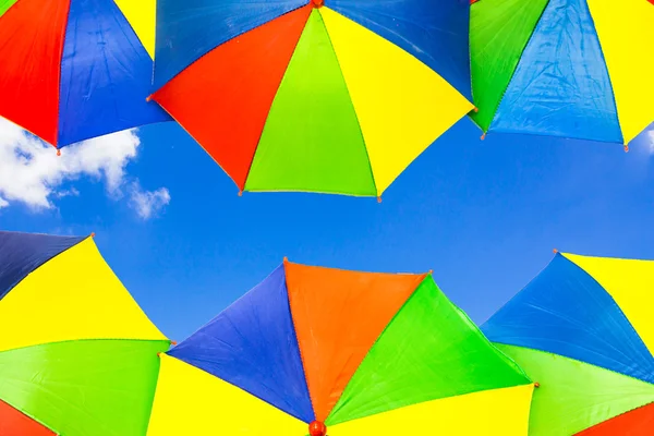 Umbrella on blue sky with cloud — Stock Photo, Image