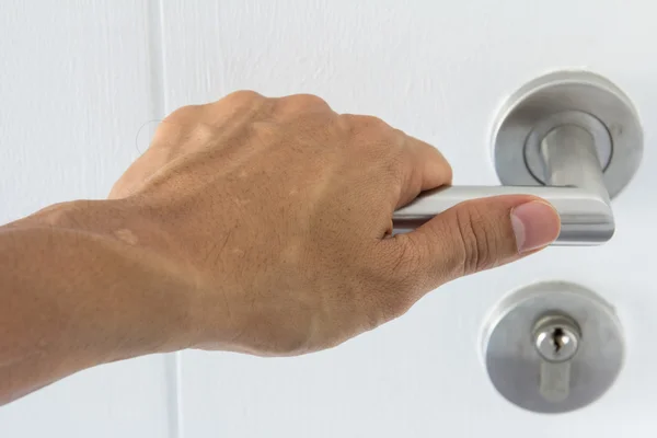 Hand on a handle wooden door to open — Stock Photo, Image