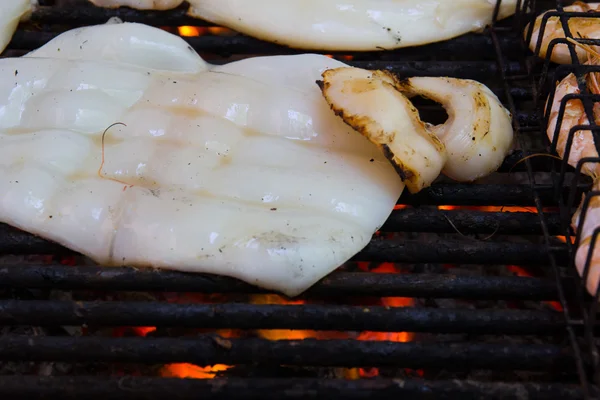 Grilled seafood on flaming grill. — Stock Photo, Image